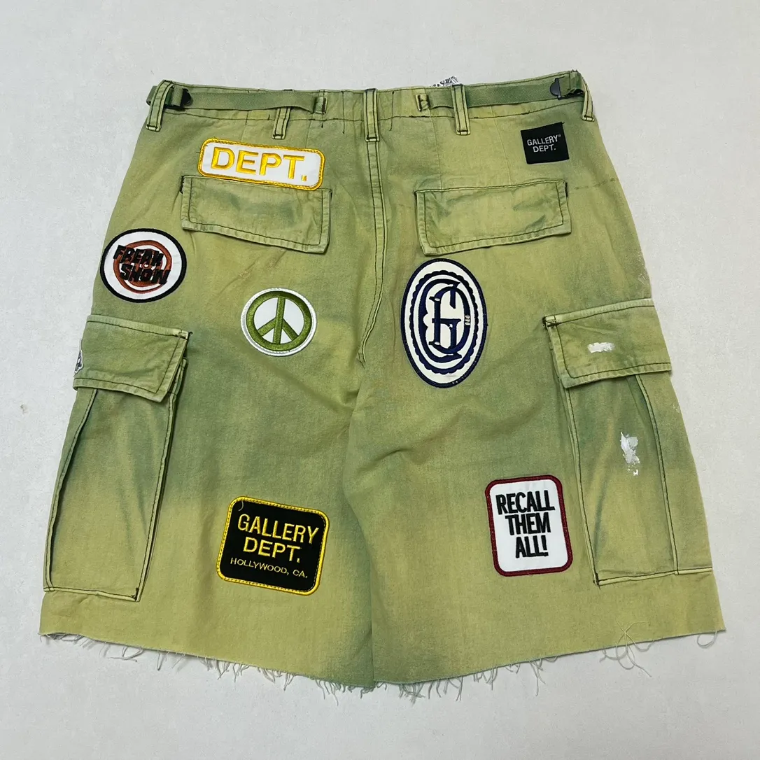 GALLERY DEPT. KENZIE FATIGUE CARGO SHORTS Patch embroidered shorts, distressed ink-splashed overalls, olive green size 30/32/34/36, heavy wash garment dyeing, jetted horse fade, washed and distressed products, each piece is slightly different, each piece is a work of art, Shimada machine embroidery, hand-splashed ink graffiti